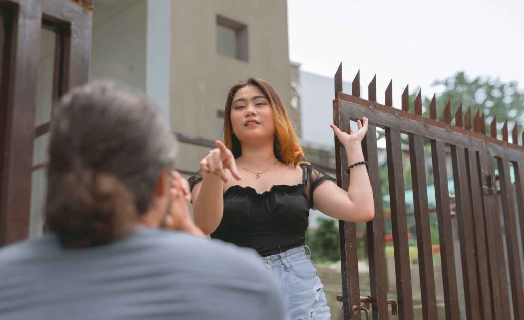 Woman reprimanding man for stalking her