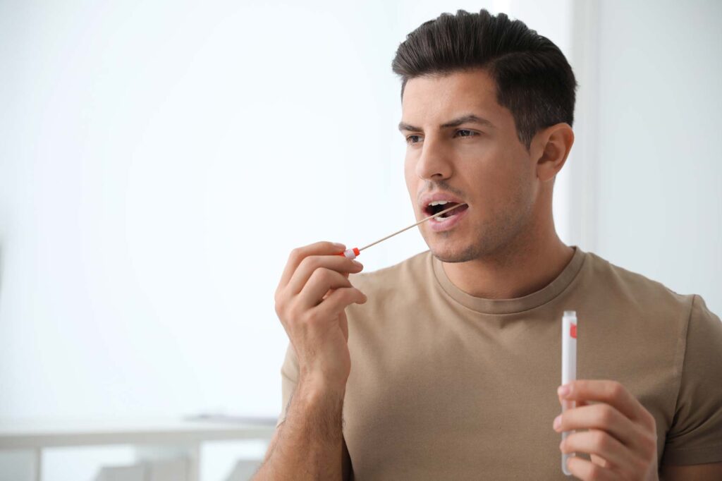 Man taking swab mouth paterntity test