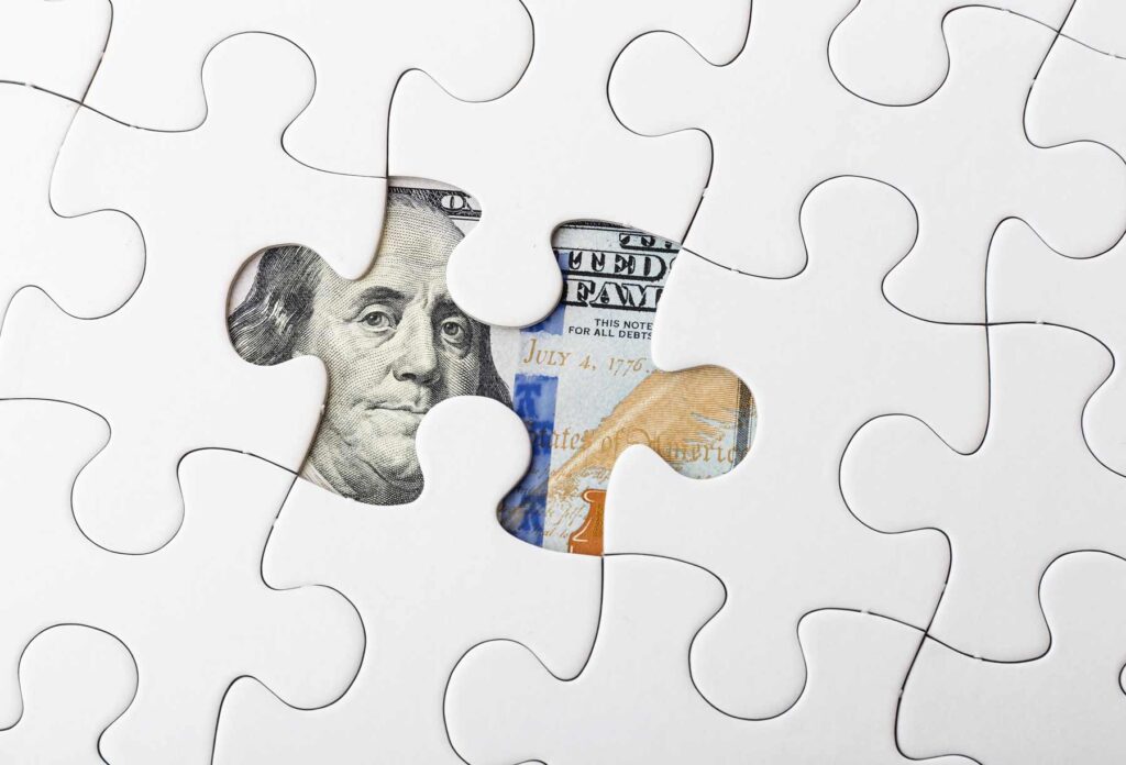 Hidden Money under a Puzzle piece